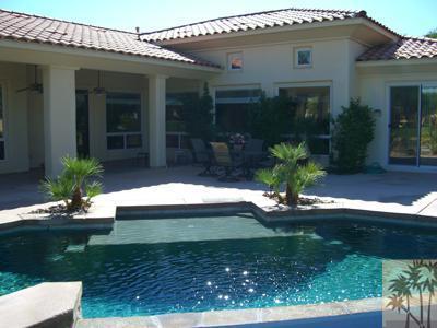 303 Loch Lomond Road Rancho Mirage, CA 92270 - Photo 23 of 25 a front view of house with yard