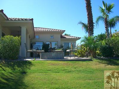 303 Loch Lomond Road Rancho Mirage, CA 92270 - Photo 25 of 25 a house view with swimming pool and garden space