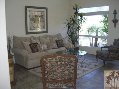 303 Loch Lomond Road Rancho Mirage, CA 92270 - Photo 3 of 25 a living room with furniture and a large window