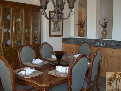 303 Loch Lomond Road Rancho Mirage, CA 92270 - Photo 4 of 25 a dining room with furniture and wooden floor