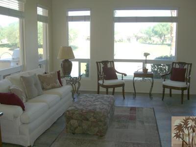 303 Loch Lomond Road Rancho Mirage, CA 92270 - Photo 6 of 25 a living room with furniture and a large window