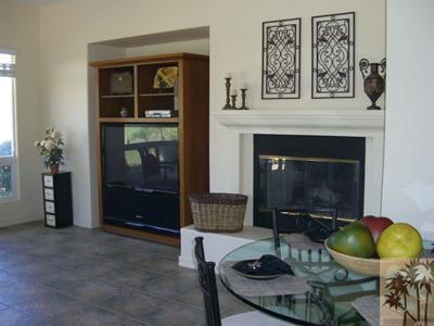 303 Loch Lomond Road Rancho Mirage, CA 92270 - Photo 7 of 25 a living room with furniture and a fireplace