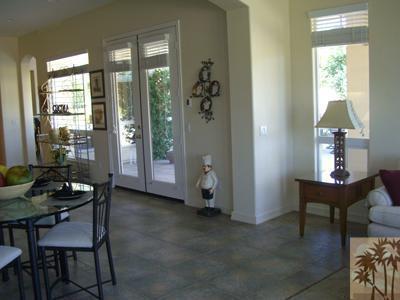 303 Loch Lomond Road Rancho Mirage, CA 92270 - Photo 8 of 25 a living room with furniture and a window