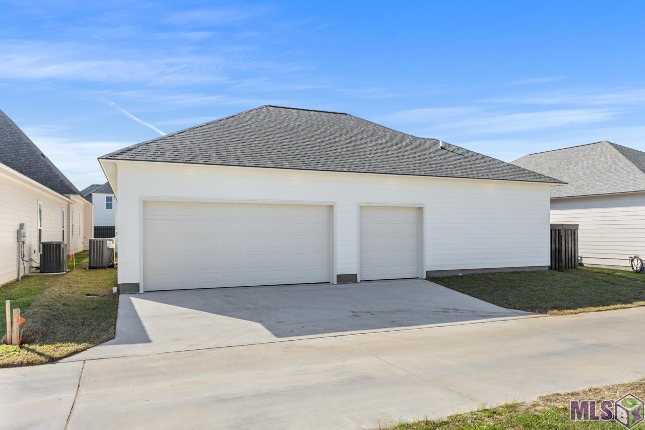 13715 Sweet Cherry Drive Baton Rouge, LA 70810 - Photo 30 of 35 Rear view of the home - 2 car garage and golf cart area