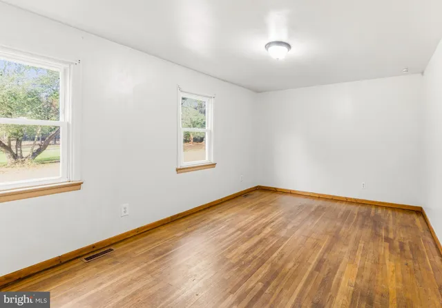 a view of an empty room and window