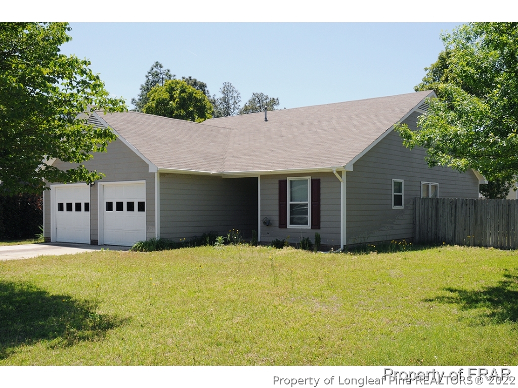 720 Rim Road Fayetteville, NC 28314 - Photo 1 of 1 a view of a house with a yard