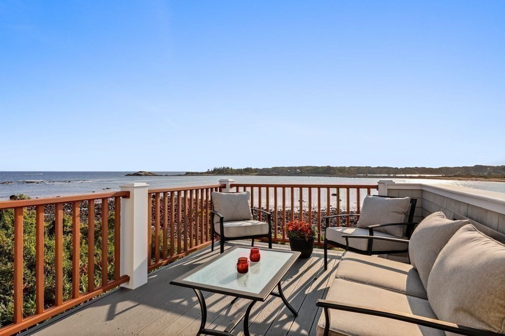 284 Atlantic Road Gloucester, MA 01930 - Photo 21 of 41 a balcony with wooden floor outdoor seating and city view