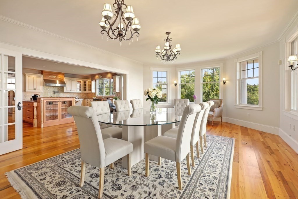 284 Atlantic Road Gloucester, MA 01930 - Photo 6 of 41 a view of a dining room with furniture wooden floor and chandelier