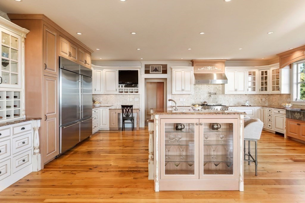 284 Atlantic Road Gloucester, MA 01930 - Photo 8 of 41 a large kitchen with stainless steel appliances kitchen island granite countertop a refrigerator and cabinets