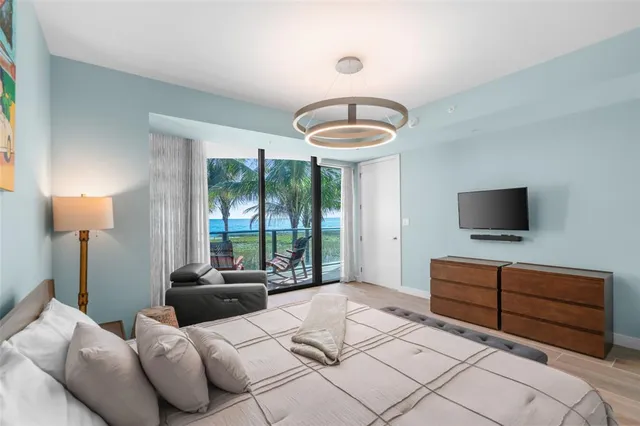 a view of a floor to ceiling window and an outdoor living room