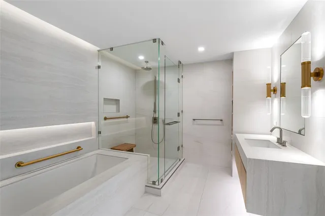 a bathroom with a tub and a shower