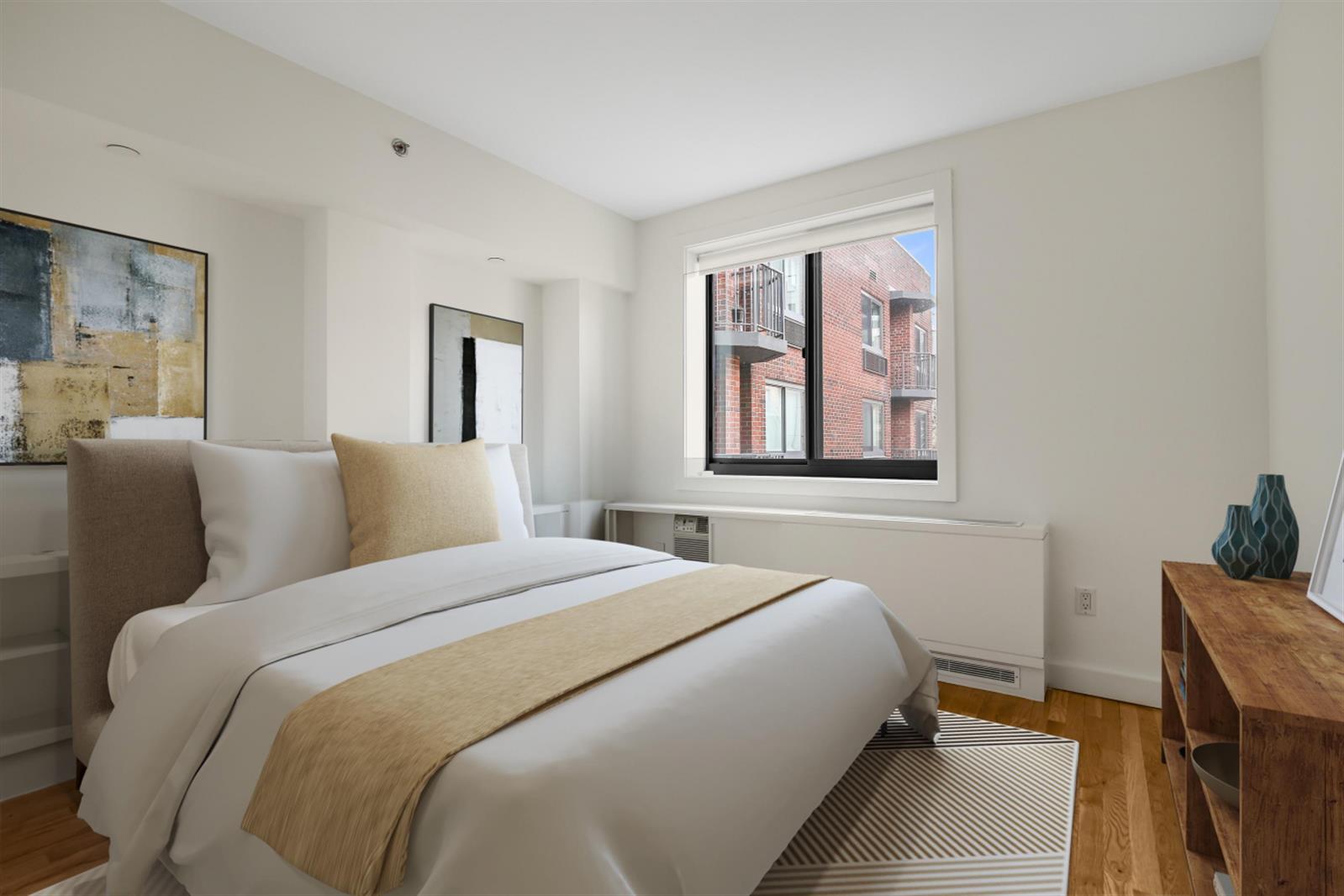 101 West 15th Street, Unit 229 Manhattan, NY 10011 - Photo 1 of 7 a bedroom with a bed and a window