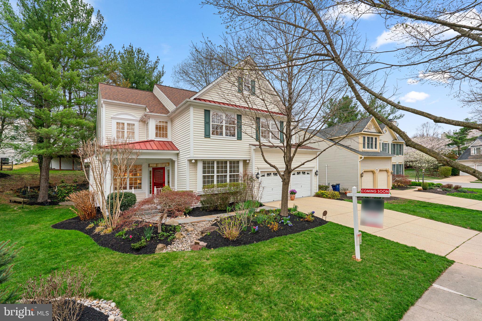 a view of a house with a yard patio and fire pit