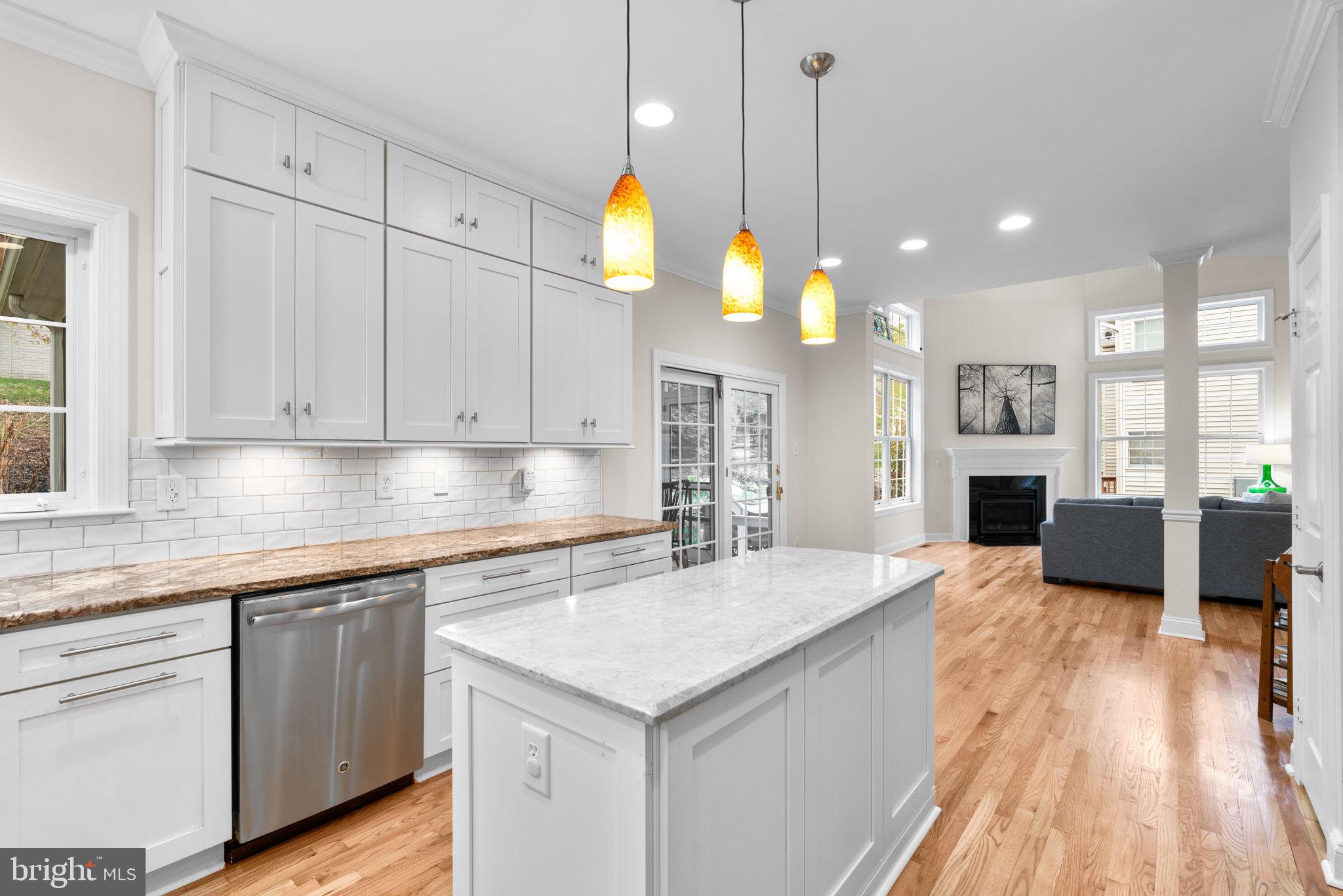 6429 Empty Song Road Columbia, MD 21044 - Photo 13 of 54 a kitchen with cabinets and wooden floor