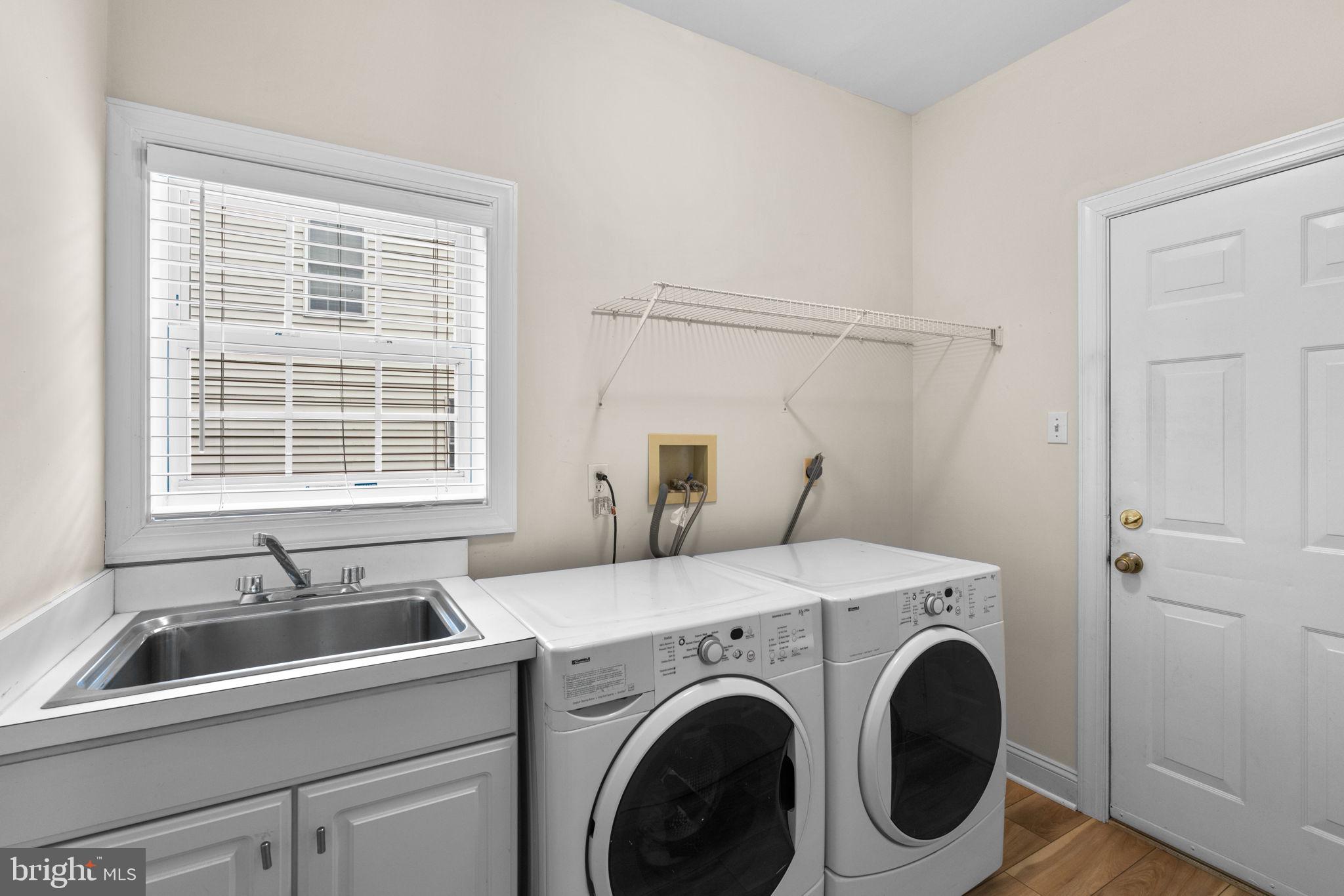 6429 Empty Song Road Columbia, MD 21044 - Photo 20 of 54 a utility room with dryer and washer