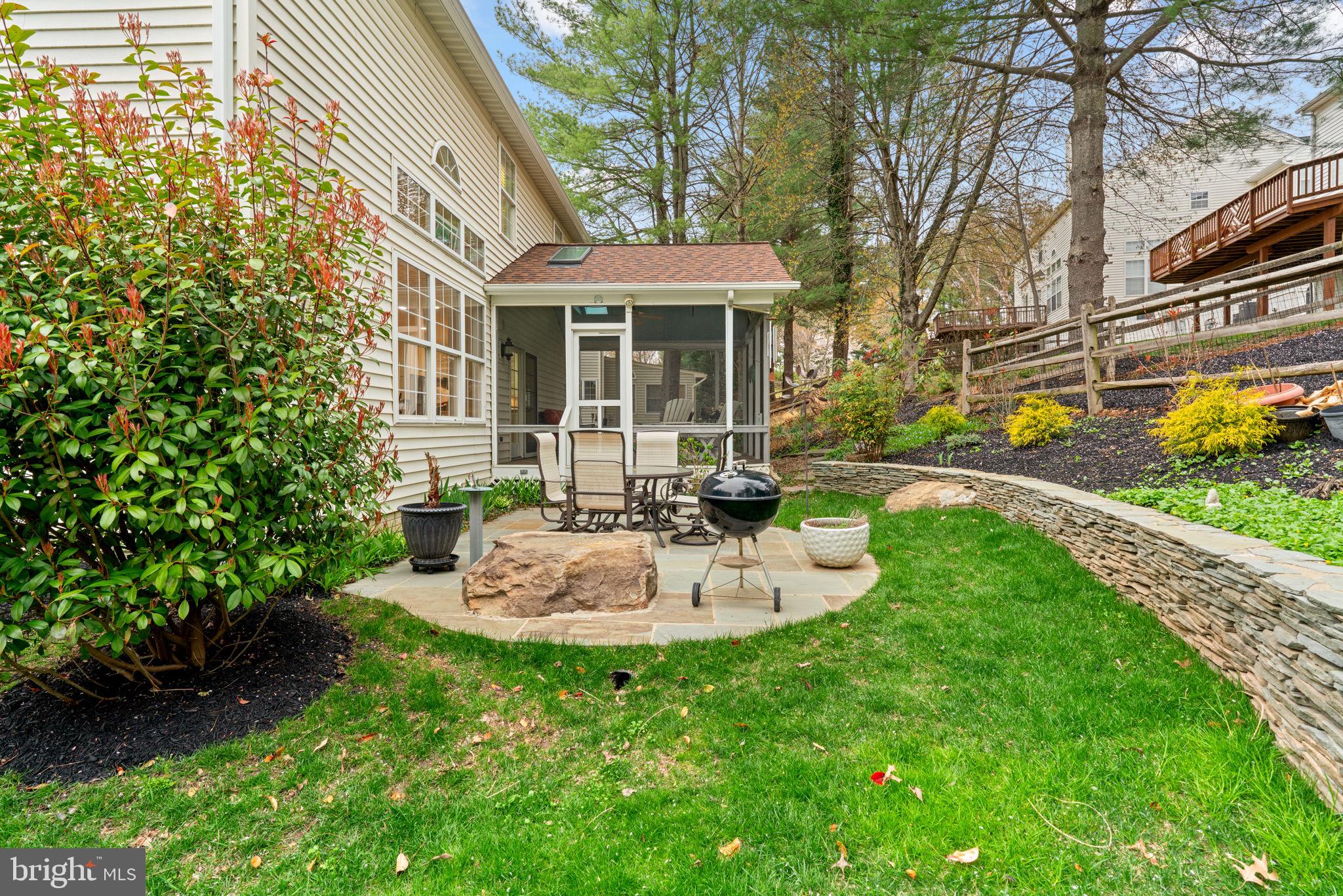 6429 Empty Song Road Columbia, MD 21044 - Photo 42 of 54 a view of a house with backyard sitting area and garden