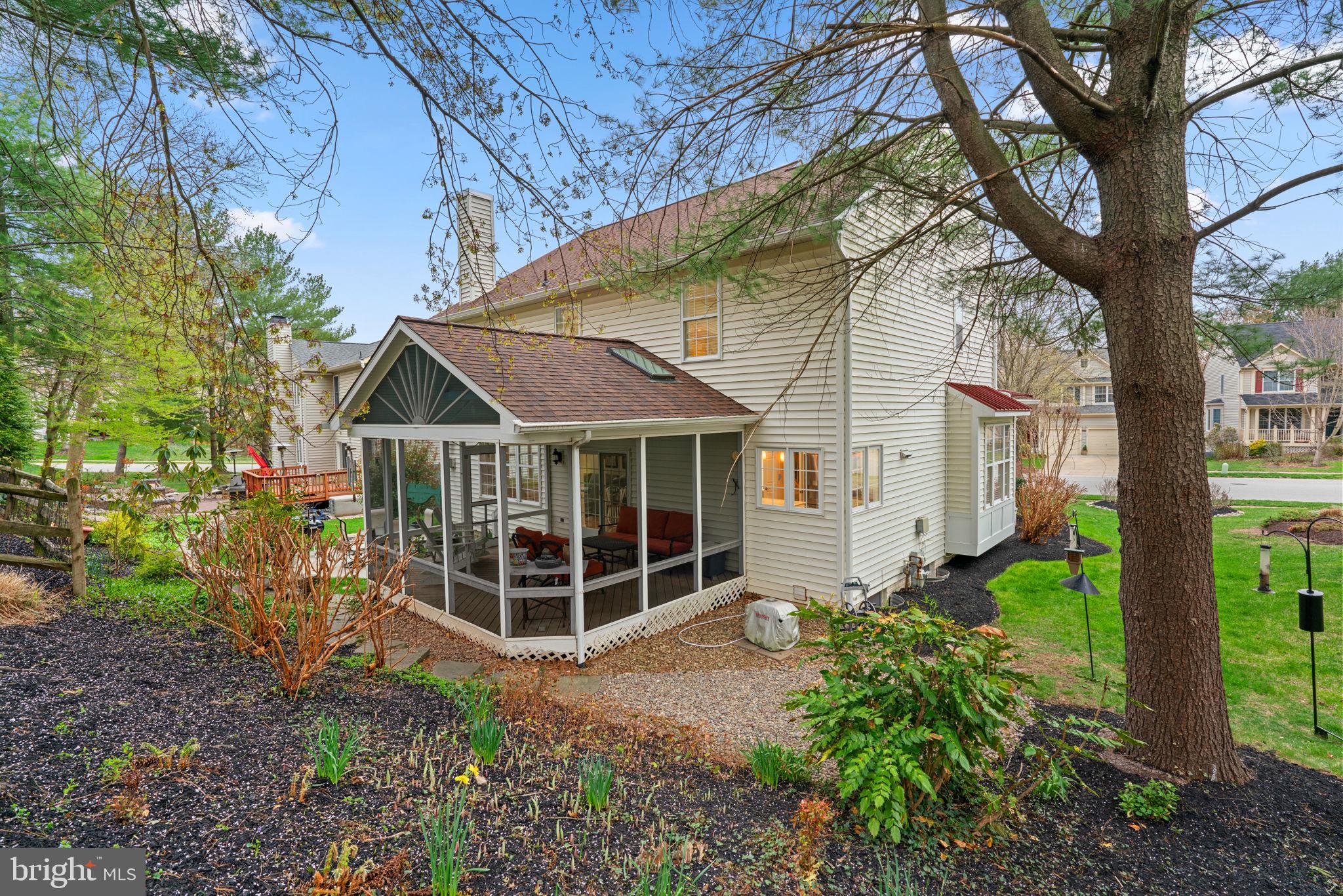 6429 Empty Song Road Columbia, MD 21044 - Photo 44 of 54 a view of a house with a yard and potted plants