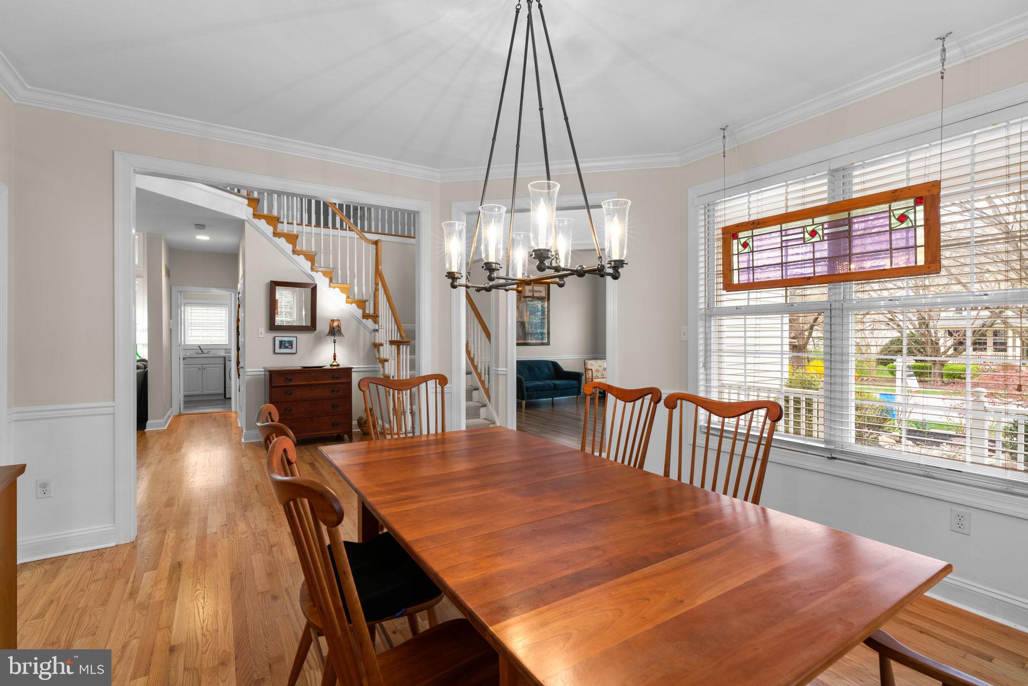 6429 Empty Song Road Columbia, MD 21044 - Photo 9 of 54 a view of a dining room with furniture window and wooden floor