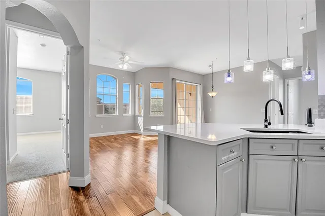 a view of a bathroom with a sink and mirror