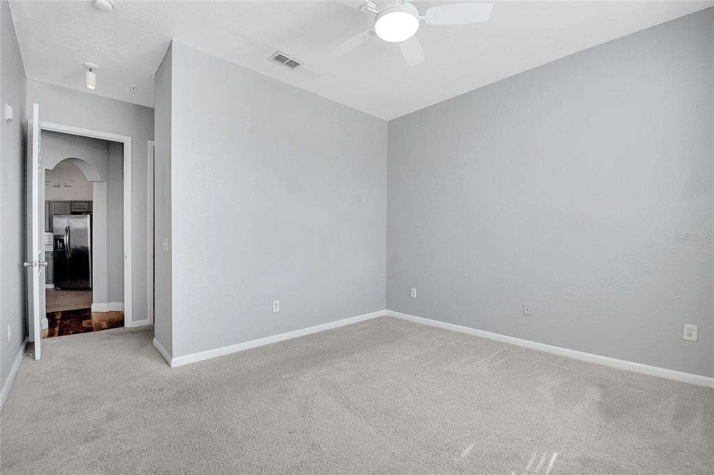 617 Terrace Ridge Circle, Unit 617 Davenport, FL 33896 - Photo 23 of 40 an empty room with a bathroom