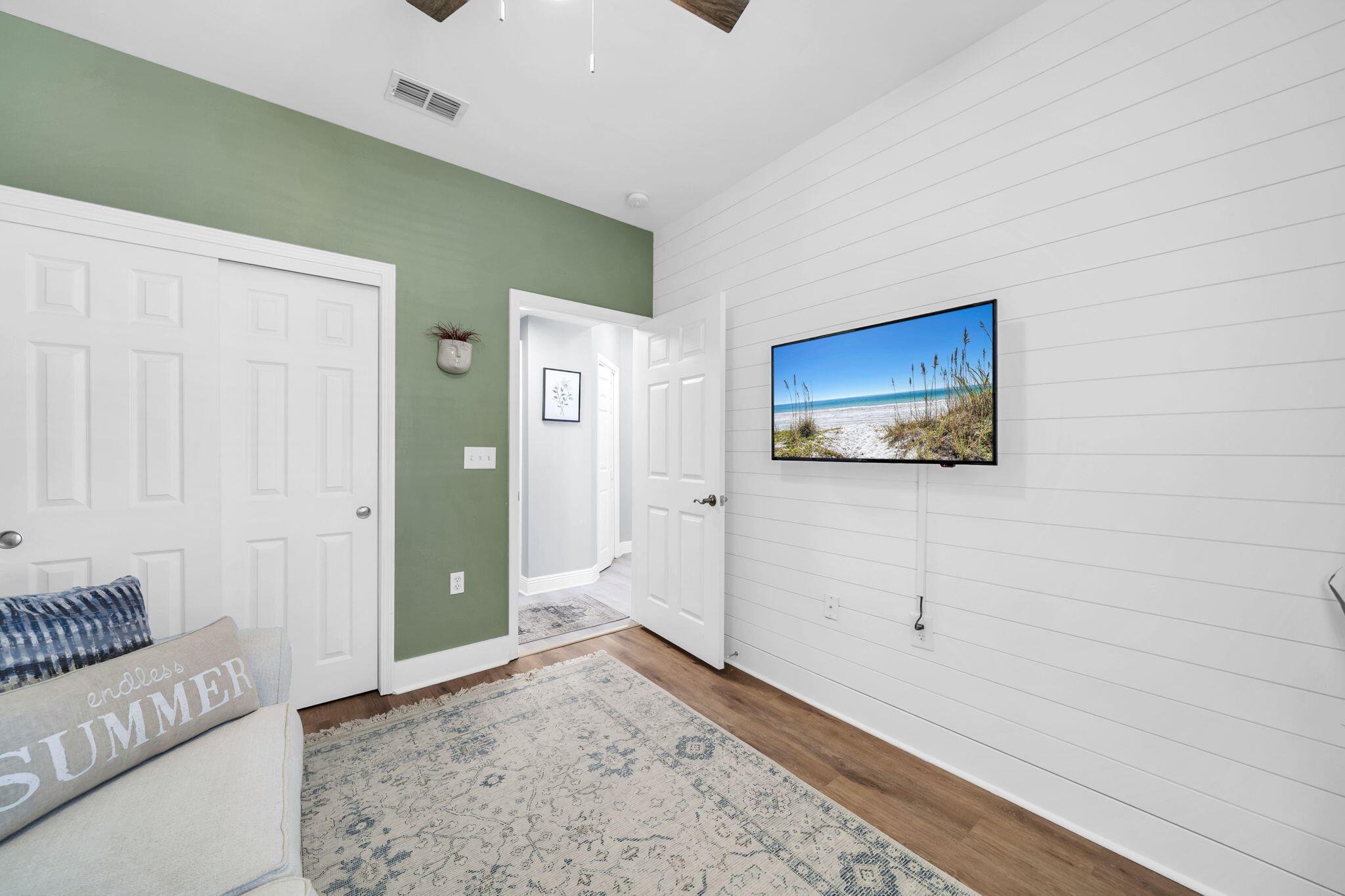 117 Village Boulevard, Unit 711 Santa Rosa Beach, FL 32459 - Photo 20 of 47 a view of a livingroom with wooden floor and cabinet