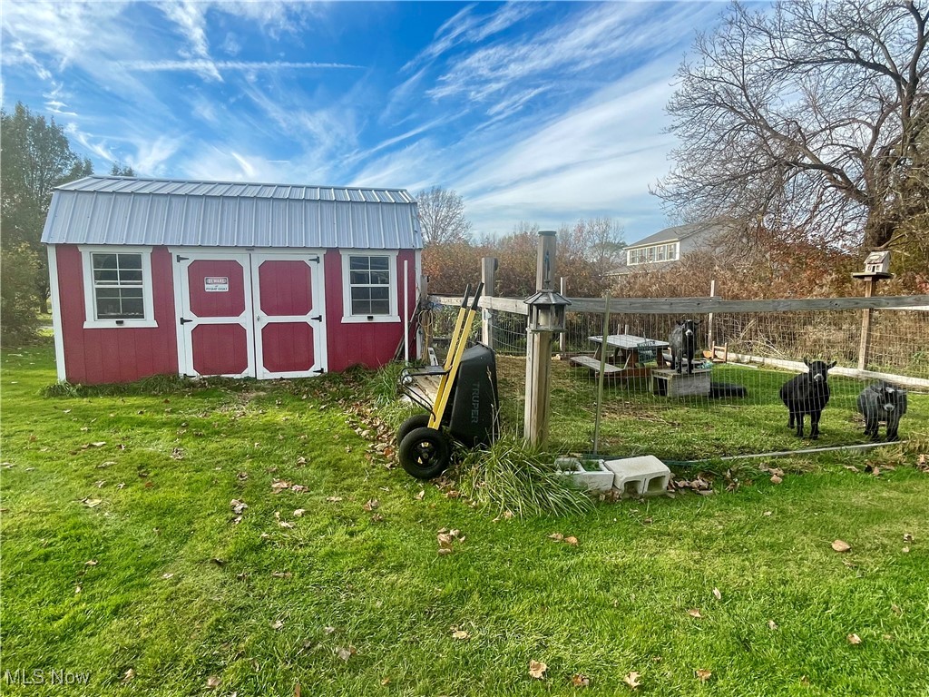 7990 Quarry Road Amherst, OH 44001 - Photo 28 of 29 View of outdoor structure featuring a lawn