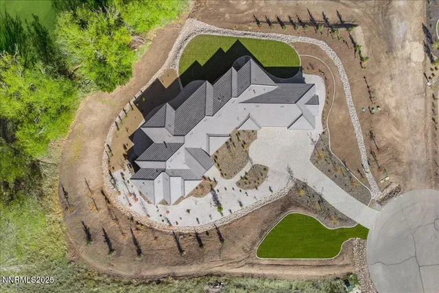 an aerial view of a residential houses and outdoor space
