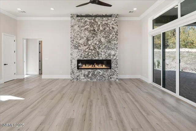 a view of an entryway with wooden floor and windows