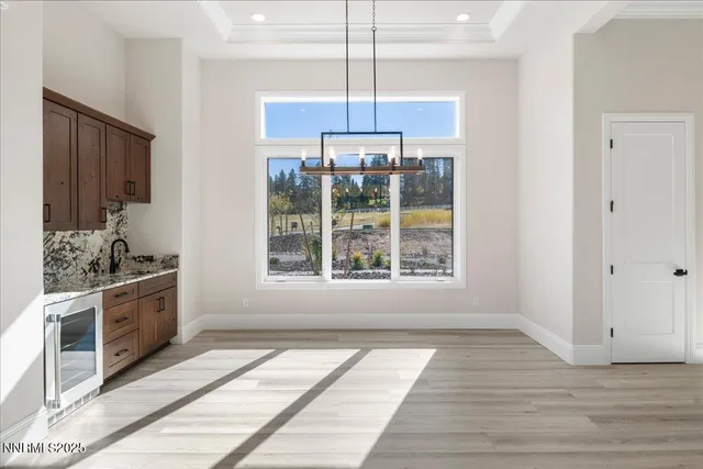 a kitchen with stainless steel appliances kitchen island granite countertop a stove refrigerator and cabinets