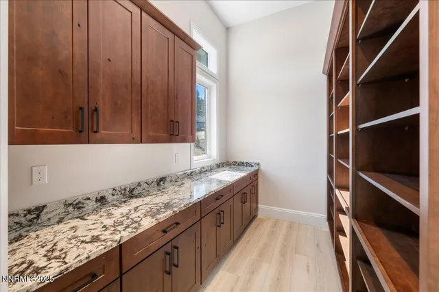 a kitchen with a stove and a cabinets