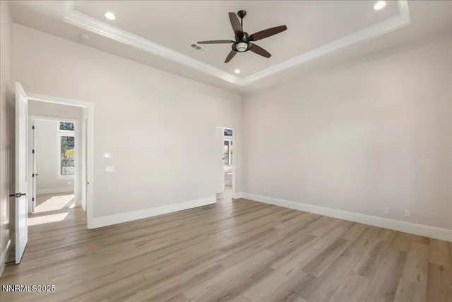 a bathroom with a granite countertop sink a toilet a mirror and shower