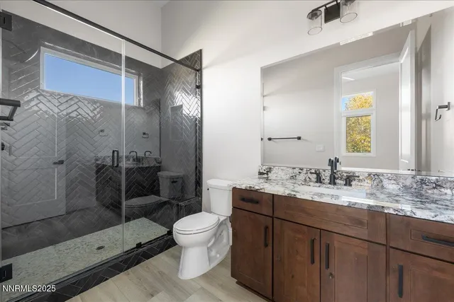 a bedroom with a bed and a view of bathroom