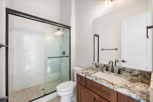 a large bathroom with a sink and a large mirror