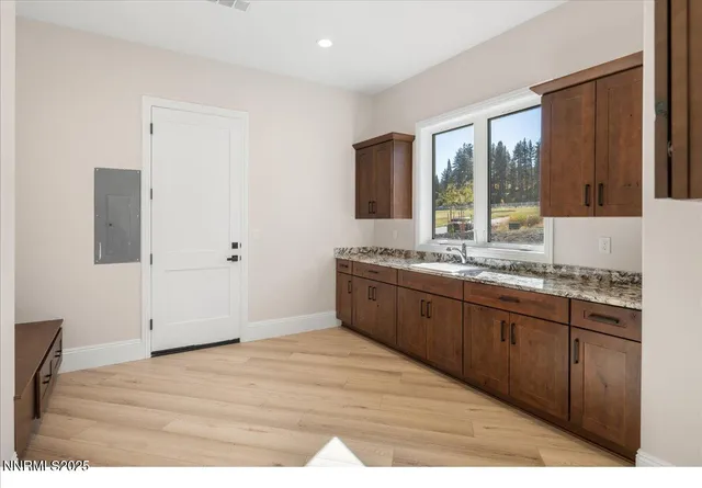 a view of a hallway with chandelier and entryway