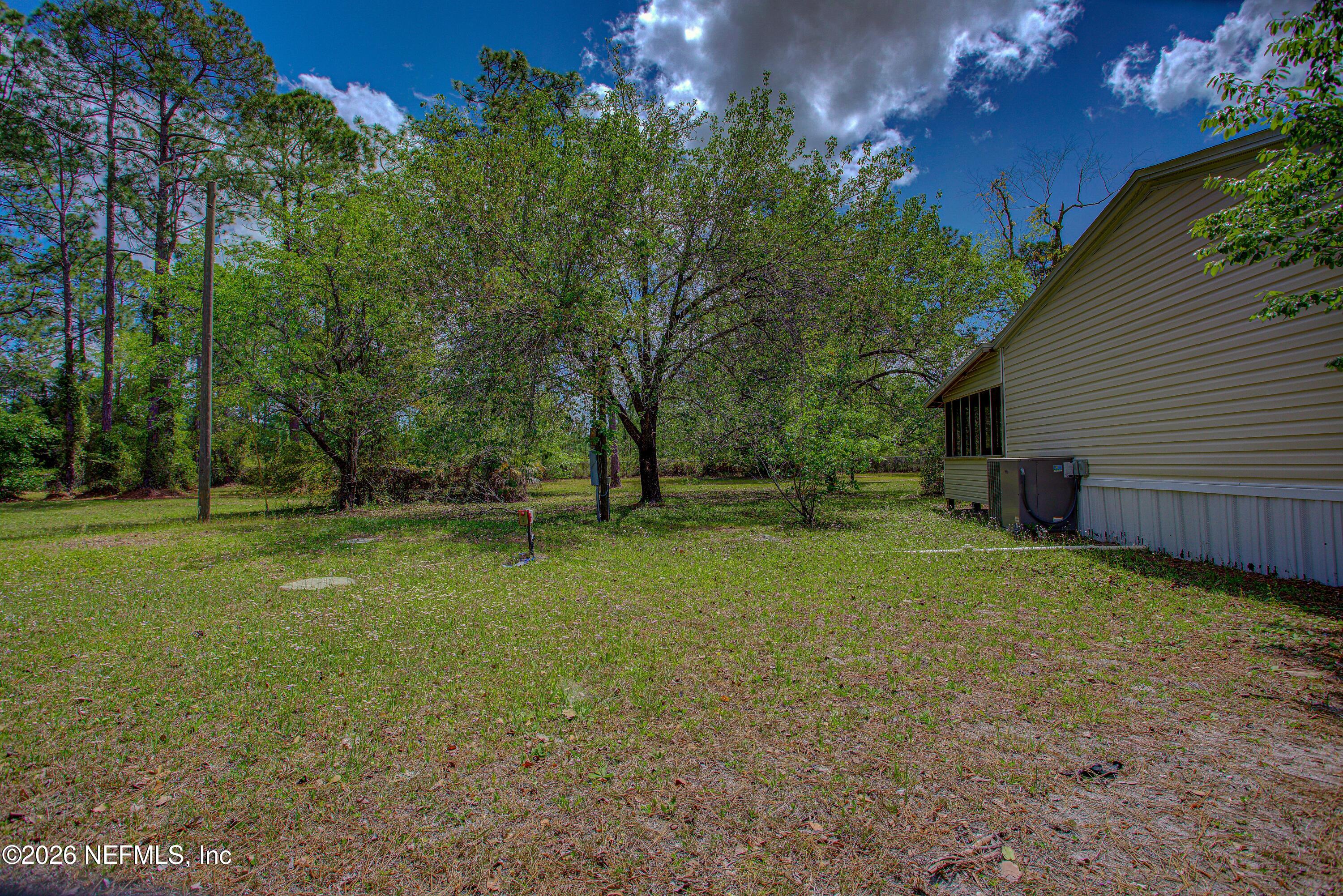 28050 Roundup Place Hilliard, FL 32046 - Photo 10 of 43 20260402-28050_Roundup_Pl-25