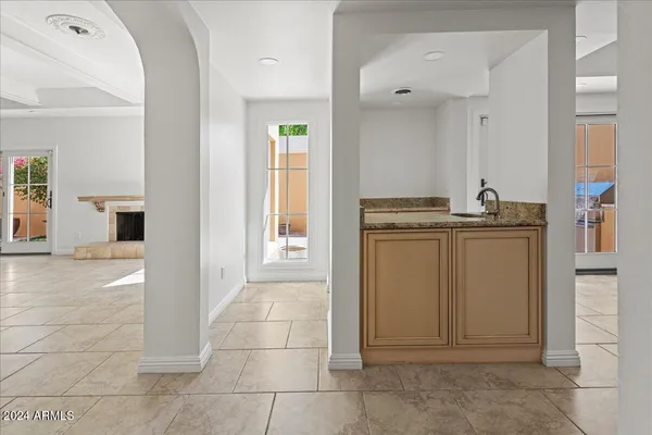 a kitchen with a sink and cabinets
