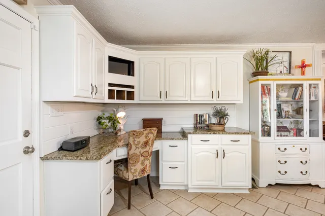a kitchen with stainless steel appliances granite countertop a sink and cabinets