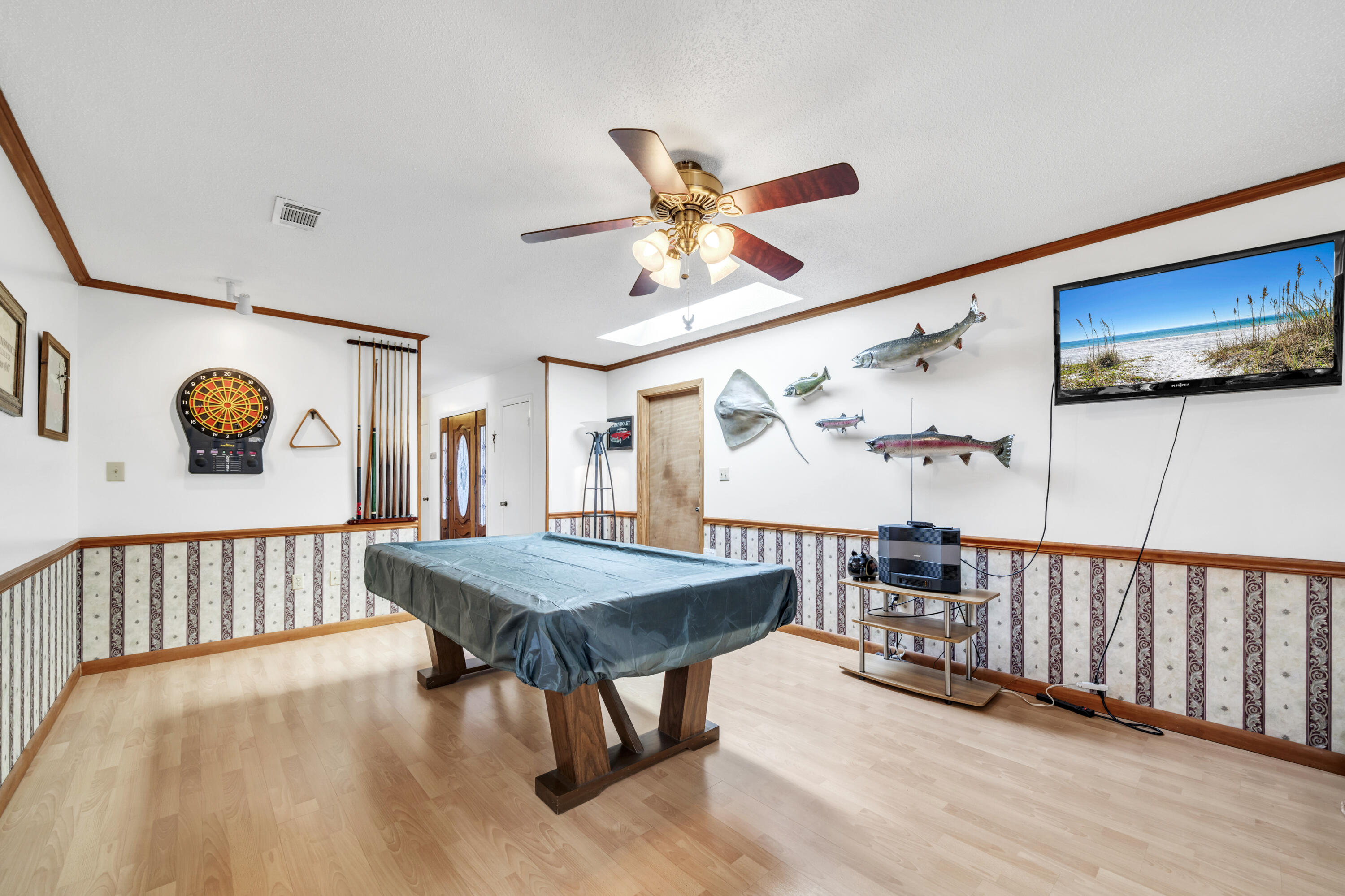 32 Walnut Avenue Shalimar, FL 32579 - Photo 18 of 56 a dining room with wooden floor a table and chairs