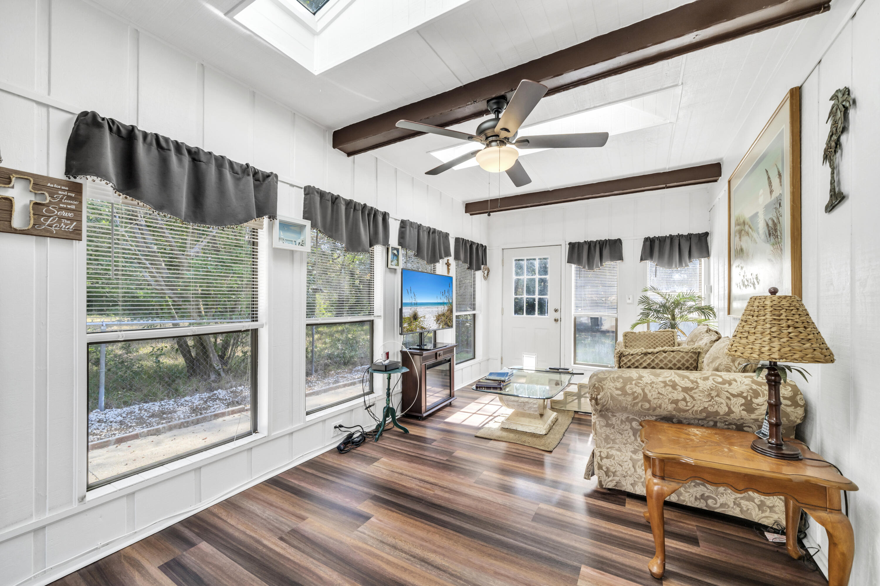 32 Walnut Avenue Shalimar, FL 32579 - Photo 21 of 56 a living room with furniture and a floor to ceiling window