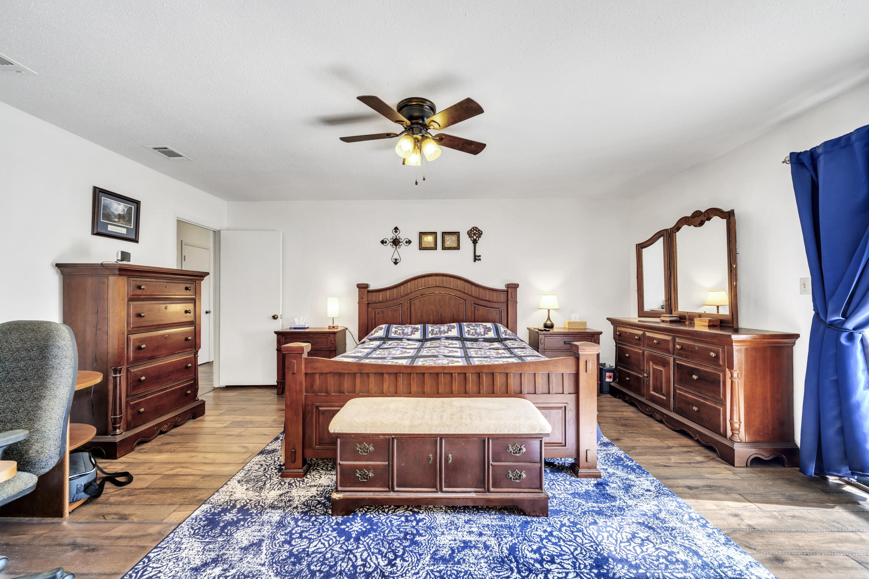 32 Walnut Avenue Shalimar, FL 32579 - Photo 24 of 56 a bedroom with furniture and a dresser