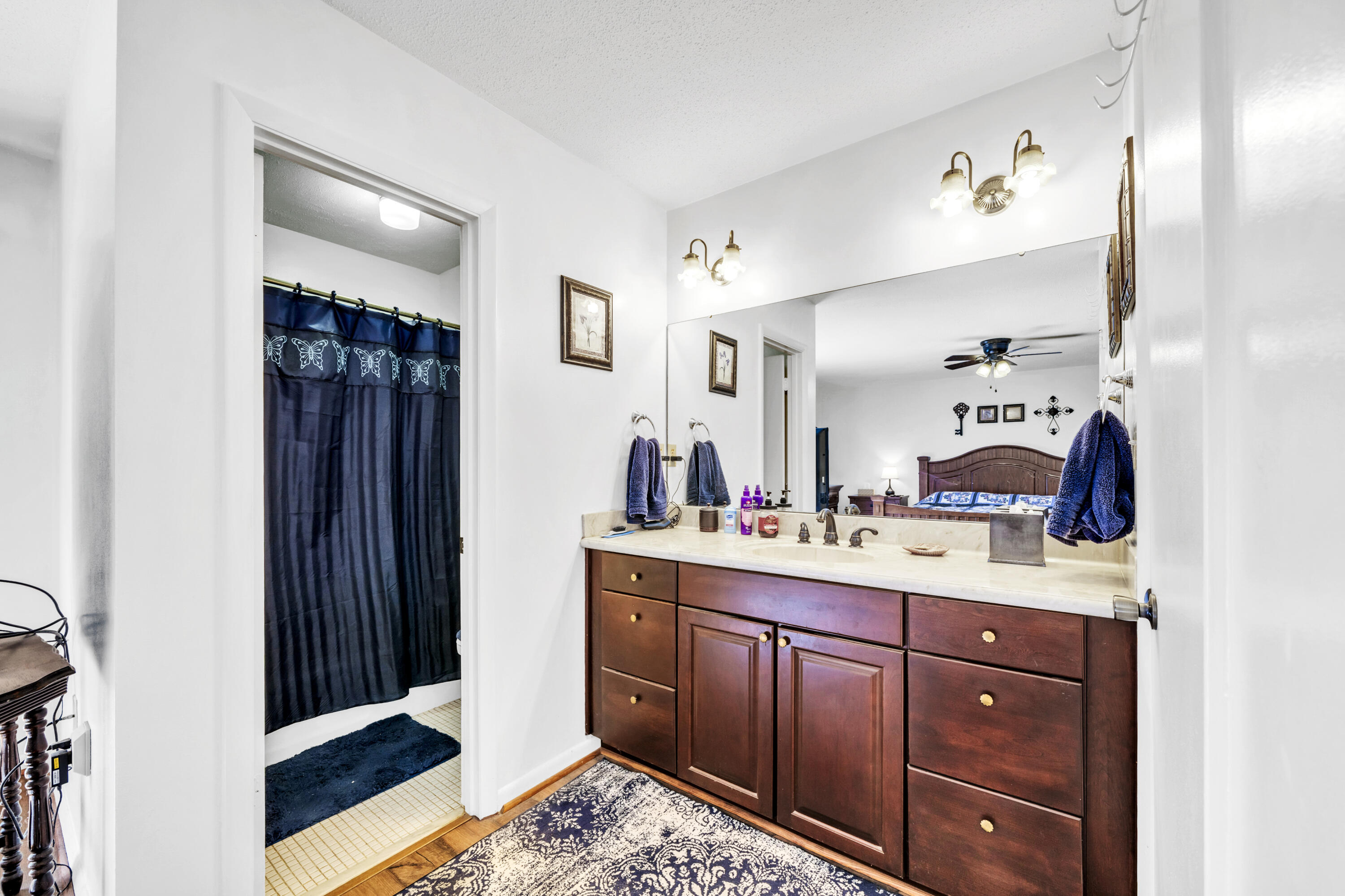 32 Walnut Avenue Shalimar, FL 32579 - Photo 25 of 56 a spacious bathroom with a sink mirror and vanity