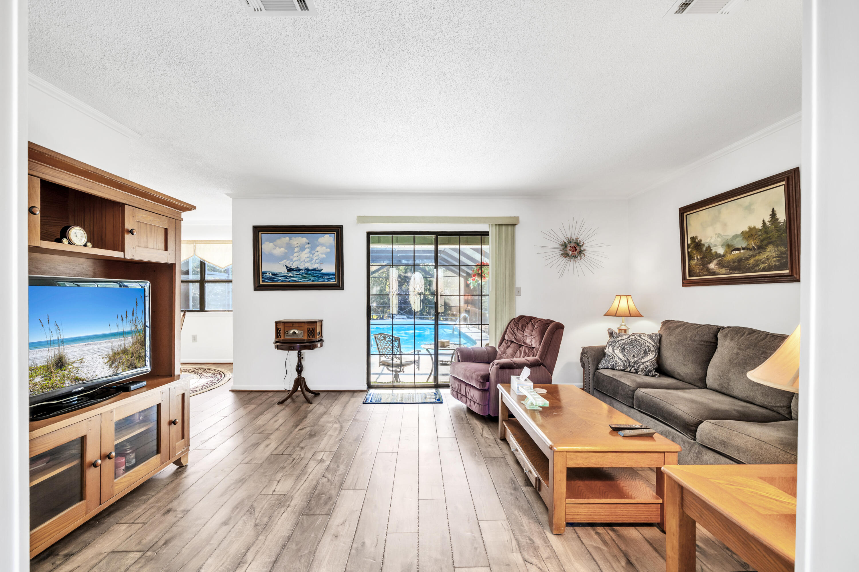 32 Walnut Avenue Shalimar, FL 32579 - Photo 3 of 56 a living room with furniture and a flat screen tv