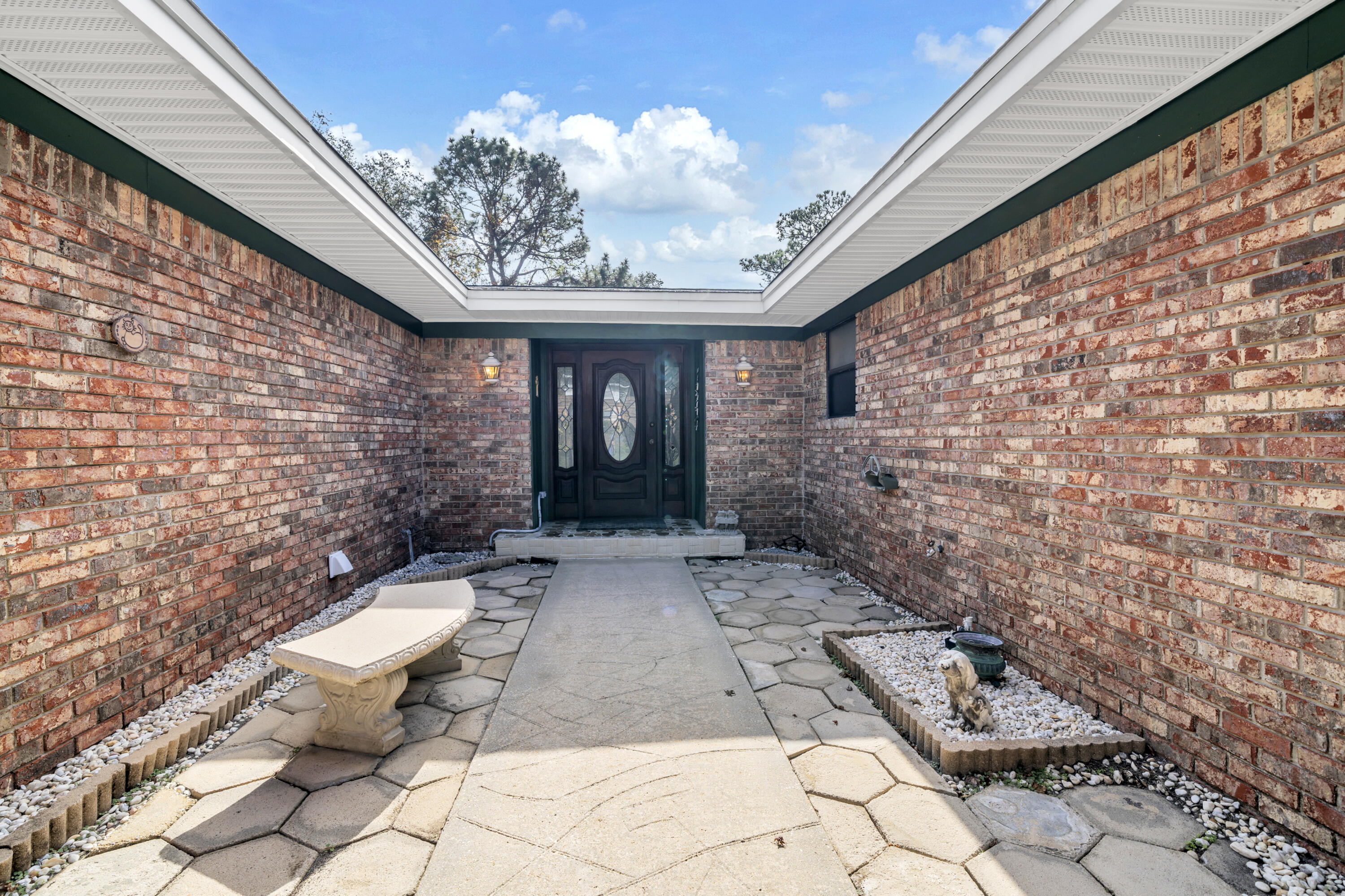32 Walnut Avenue Shalimar, FL 32579 - Photo 50 of 56 a view of a backyard with sitting area
