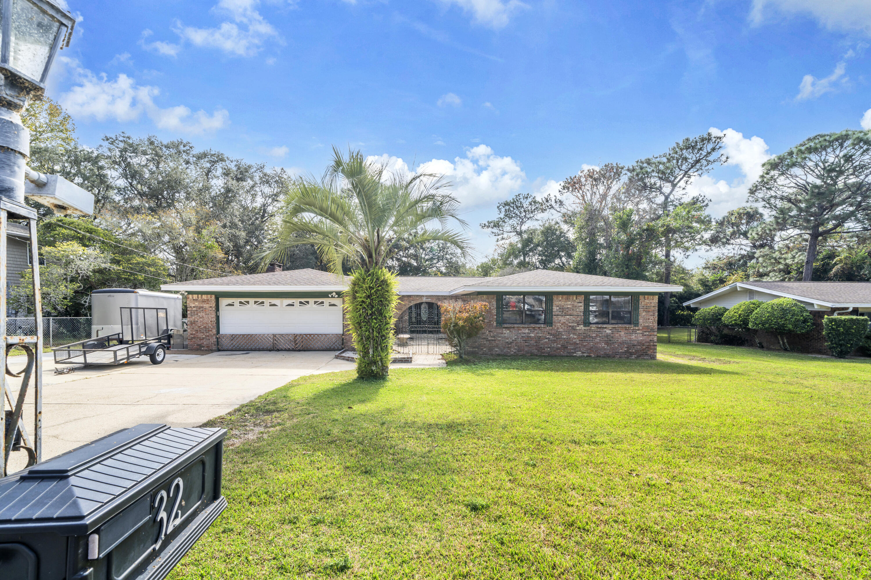 32 Walnut Avenue Shalimar, FL 32579 - Photo 56 of 56 a front view of a house with garden