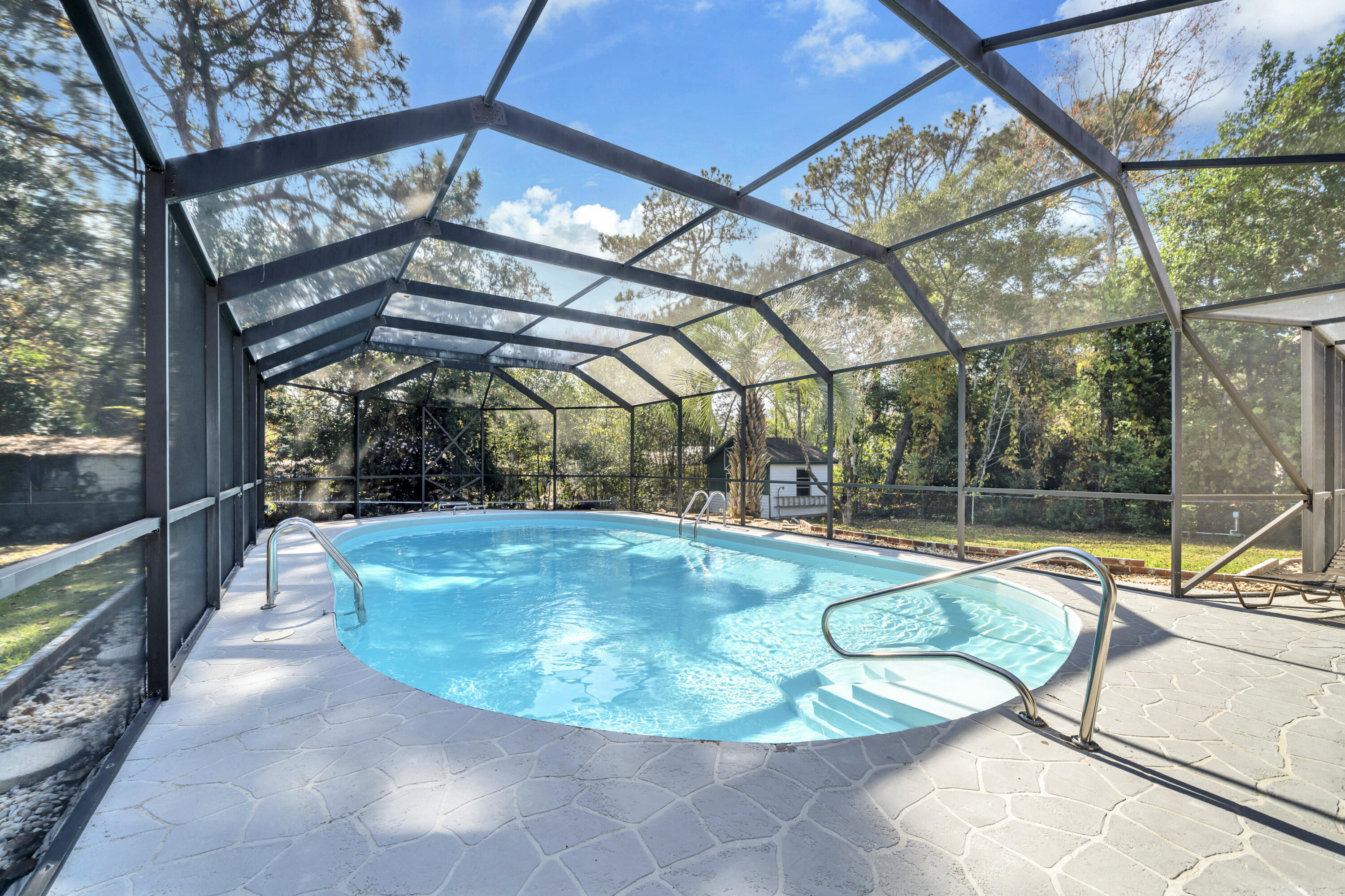 32 Walnut Avenue Shalimar, FL 32579 - Photo 6 of 56 a view of a swimming pool with a patio