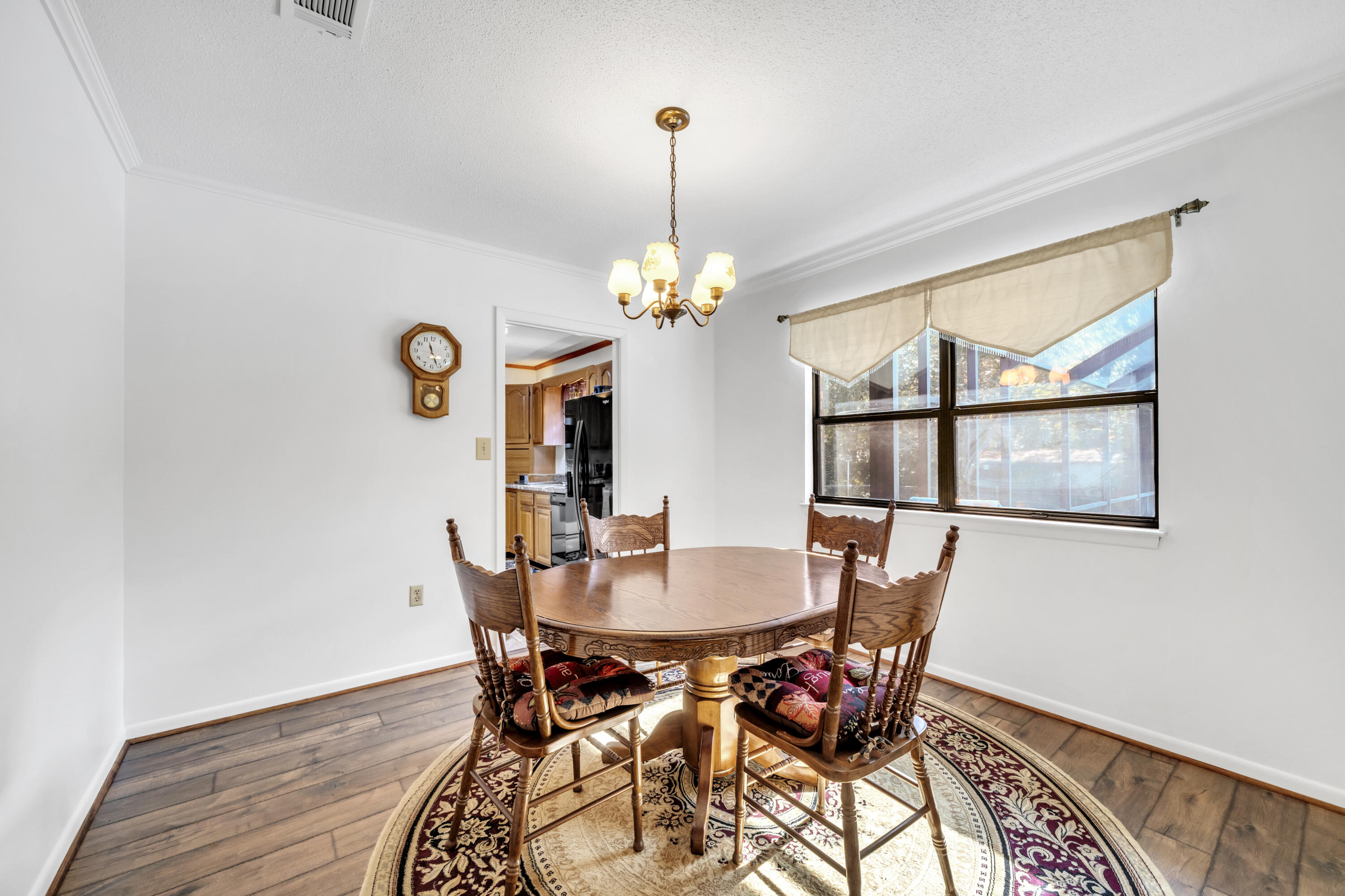 32 Walnut Avenue Shalimar, FL 32579 - Photo 10 of 56 a view of a dining room with furniture and window