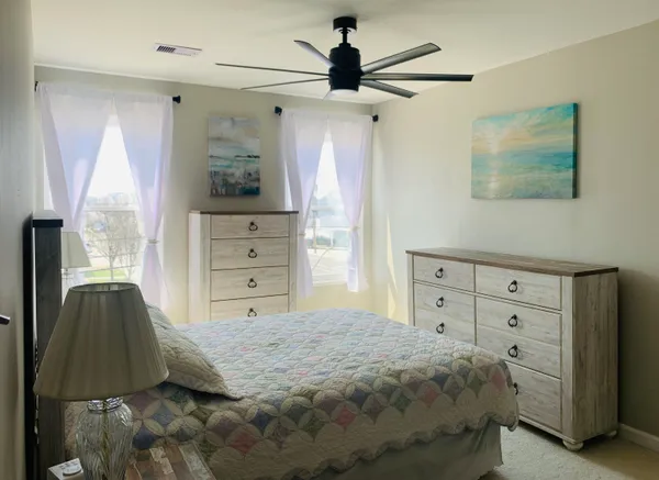 a bedroom with a bed and a walk in closet