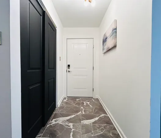 a view of staircase with white walls and railing