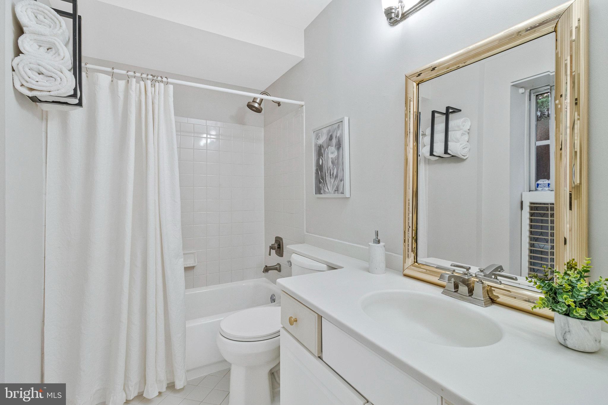 2413 20th Street Northwest, Unit 1 Washington, DC 20009 - Photo 25 of 31 a bathroom with a sink a toilet and shower