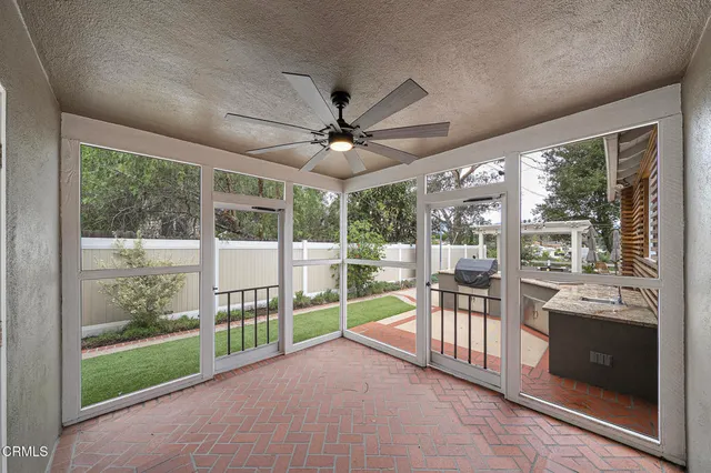 a view of a porch with furniture and a porch